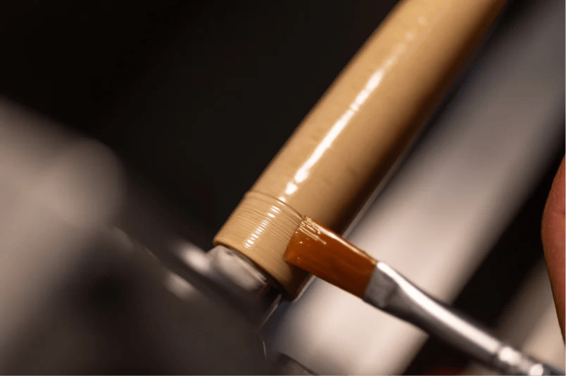 A penmaker lacquering an Aeon pen by hand in the Sardinian workshop