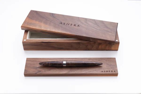 A finished Aeon pen tested and laid to rest in its walnut box