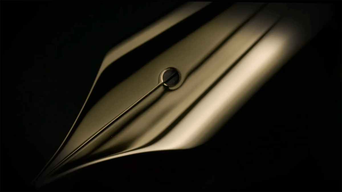 The fountain pen nib being manually polished